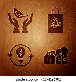 Set Eco friendly house, Sprout in hand of environmental protection, Recycle and light bulb with lightning symbol and Plastic bag with recycle on wooden background. Vector