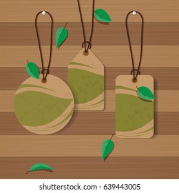 Set of Eco labels on wood texture background with green leaves.Vector illustration.