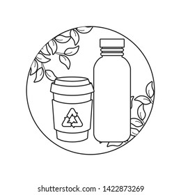 set of ecological bottles in frame with leafs