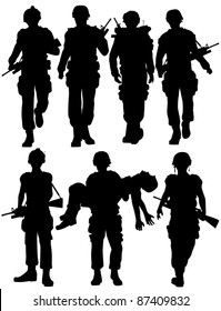 Set of editable vector silhouettes of walking soldiers