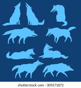 Set of editable vector silhouettes of wolves, wolf pack has a rest, blue on dark, isolated, freehand drawing 