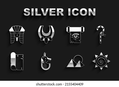 Set Egyptian anubis, Crook, Sun, pyramids, Papyrus scroll, Eye of Horus on papyrus, pharaoh and necklace icon. Vector