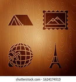 Set Eiffel tower, Tourist tent, Globe with flying plane and Postal stamp and Mountains on wooden background. Vector