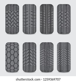 Set of eight black car tire tracks with dots