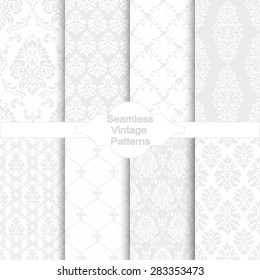 Set of eight seamless damask patterns. Classic grey wallpapers. Vintage vector backgrounds.