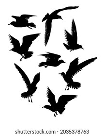 Set of eight silhouettes of flying seagulls