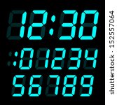 set of electronic digits. light blue numbers on a black background
