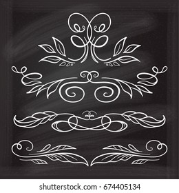 Set of elegant floral elements on the chalkboard.