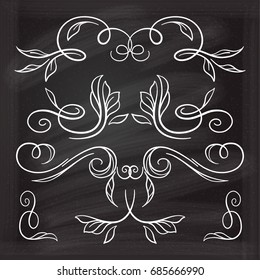 Set of elegant floral elements on the chalkboard.