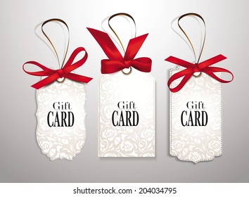 Set of elegant gift cards with red silk ribbons