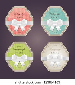 A set of elegant hand made colored paper textured retro labels with silky ribbon bow knots