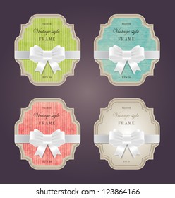 A set of elegant hand made colored paper textured retro labels with silky ribbon bow knots