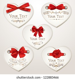 Set of elegant heart shaped cards with red bows