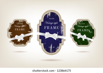 A set of elegant paper retro labels with peeled off paint and silky ribbon bow knots