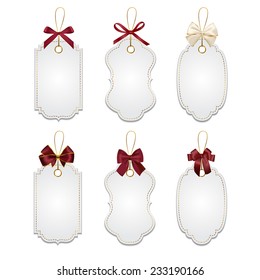 Set of elegant realistic white tags with red bows and golden elements Isolated on white background