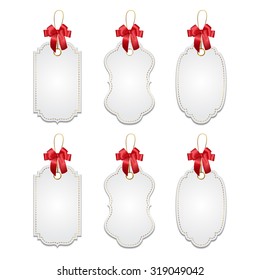 Set of elegant realistic white tags with red bows and golden elements isolated on white background. Vector EPS10 illustration. 