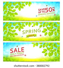 Set of elegant spring sale banners. Vector illustration. Spring day background with sunshine and tree branches.