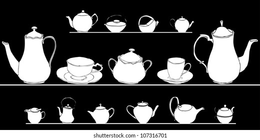 set of elegant tea pots on simple black background