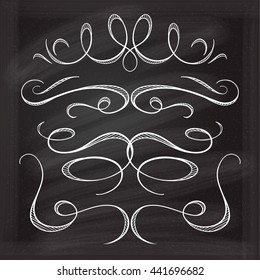 Set of elegant white flourishes for your design on the chalkboard.