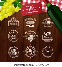 Set of elegant wine badges and labels. Vintage logo templates on wood background