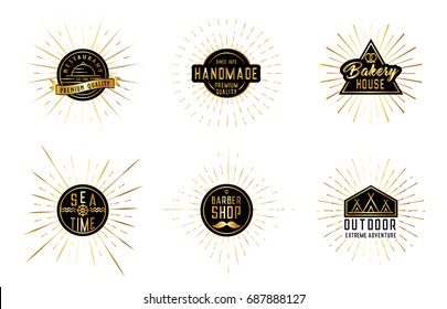 Set of emblems with gold sunburst.