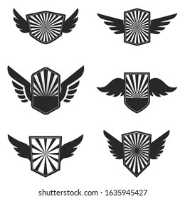Set of emblems with wings. Design element for logo, label, emblem, sign, badge. Vector illustration