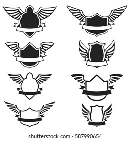 Set of the empty emblems with wings. Design elements for logo, label, badge, sign. Vector illustration