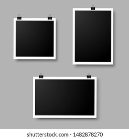 Set of empty photo frames hanging on a clip. Template or mockup for design.