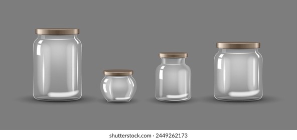 Set of empty transparent glass jars with caps