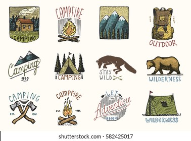 set of engraved vintage, hand drawn, old, labels or badges for camping, hiking, hunting with mountains, campfire and tent, axes. bear and backpack, wolf or red fox