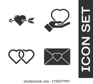 Set Envelope with Valentine heart, Amour with heart and arrow, Two Linked Hearts and Heart on hand icon. Vector