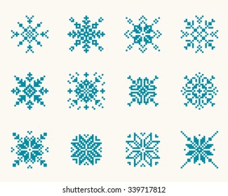 Set ethnic Slavic snowflakes. Red isolated on white background. Norwegian design. Cross stitch scheme.