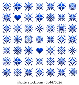 Set ethnic Slavic snowflakes. Red isolated on white background. Norwegian design. Cross stitch scheme.