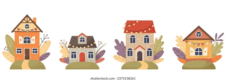 Set of fairytale houses surrounded by autumn leaves and plants.