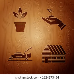 Set Farm house, Flowers in pot, Lawn mower and Sprout in hand of environmental protection on wooden background. Vector