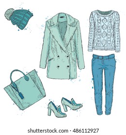 A set of fashionable women's clothing. Coats, shoes, bags, pants and hat. Wool sweater. Vector illustration. Fashion sketch. Selection of clothes for autumn-spring.