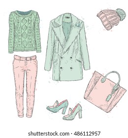 A set of fashionable women's clothing. Coats, shoes, bags, pants and hat. Wool sweater. Vector illustration. Fashion sketch. Selection of clothes for autumn-spring.