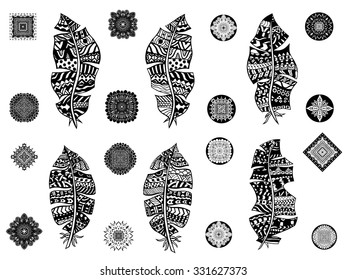 Set of feathers on a white background. Vintage tribal feathers. Series of doodle feather.