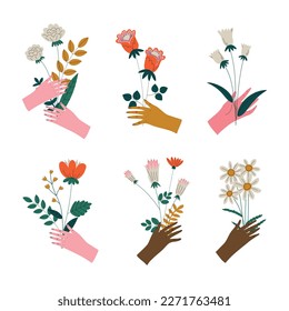Set of female hands holding bunches of blooming delicate meadow flowers. Floral decorative design elements cartoon vector illustration