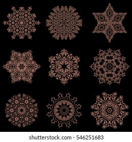 Set of file beige snowflakes and dots on a black background. Starry Sky. Vector falling snow set.