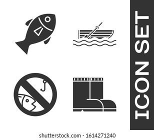 Set Fishing boots, Fish, No fishing and Fishing boat with oars on water icon. Vector