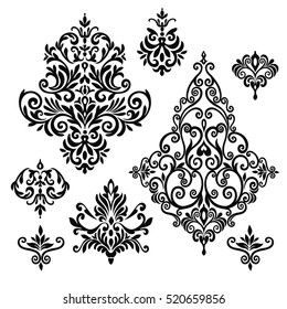 Set of five ornate foliate and floral design elements in black and white for retro design