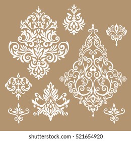 Set of five ornate foliate and floral design elements in black and white for retro design