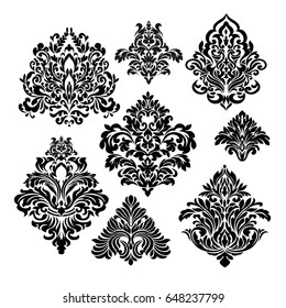Set of five ornate foliate and floral design elements in black and white for retro design