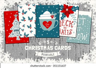 A set of five printable Christmas greeting cards in red, white and blue. Gray wood planks background, snowflakes frame, traditional Christmas symbols and elements.