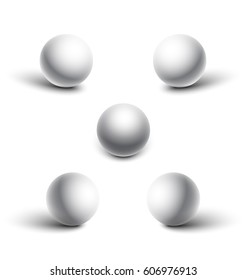 Set of five realistic white spheres with shadows.
