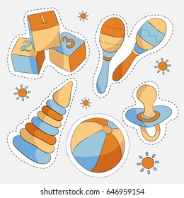 Set of five sticker style baby toys on light background
