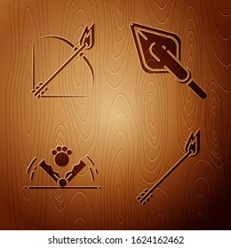Set Flame arrow, Bow and fire arrow, Trap hunting and Hipster arrow tip on wooden background. Vector