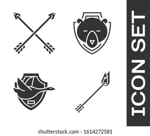 Set Flame arrow, Crossed arrows, Flying duck on shield and Bear head on shield icon. Vector