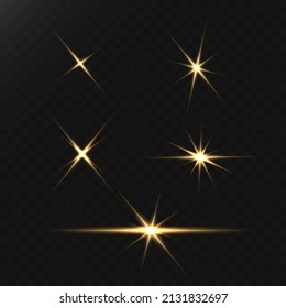 A set of flares, bright lights and sparkles on a black background. Golden flashes and glare. Abstract golden isolated lights Bright rays of light. Glowing lines.